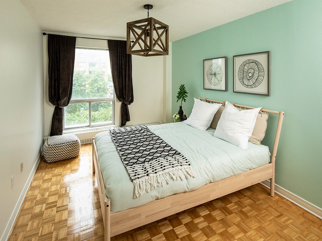 a bedroom with a bed and a window