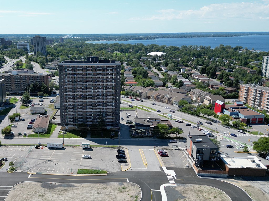 an aerial view of a city with a tall building