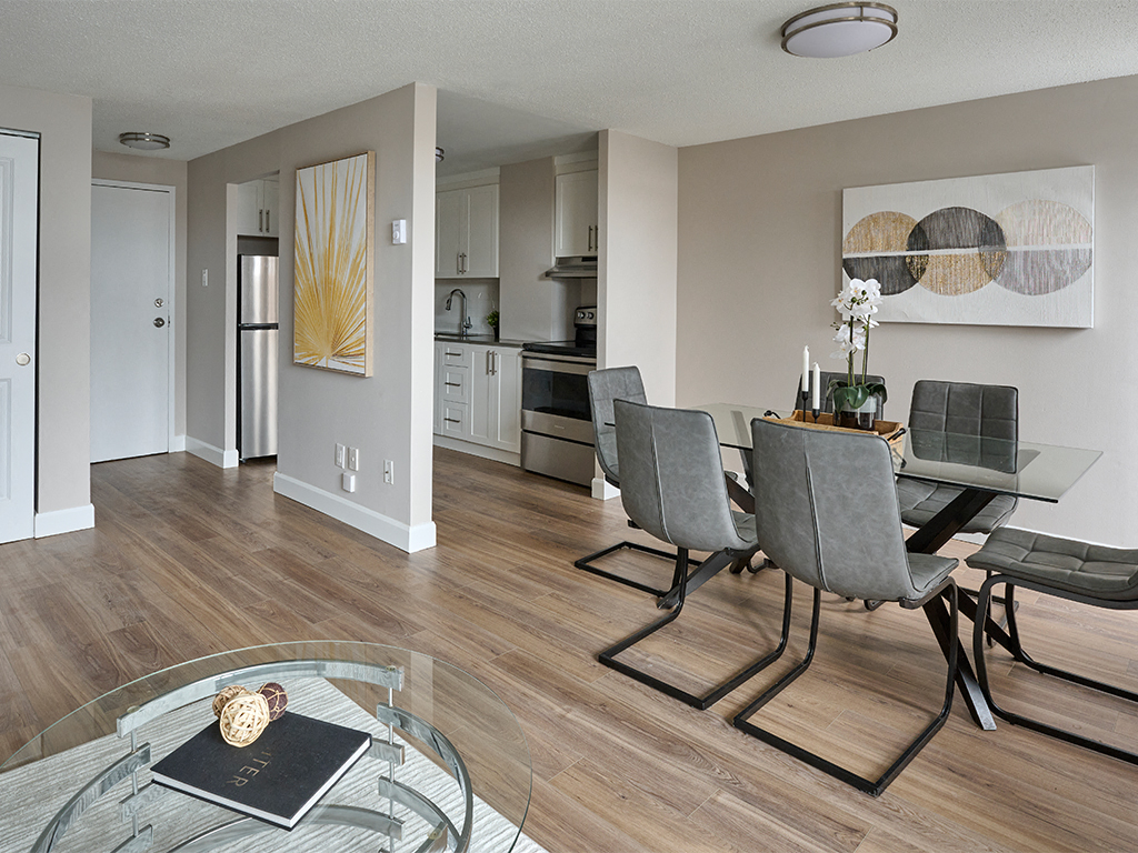 an open living room and dining room with a table and chairs