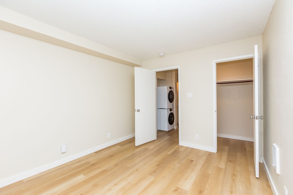 A room with a white wall and a white door.