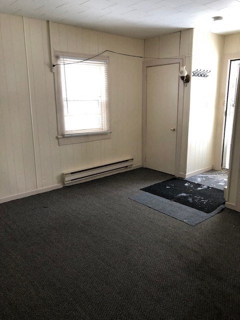an empty room with a door and a window