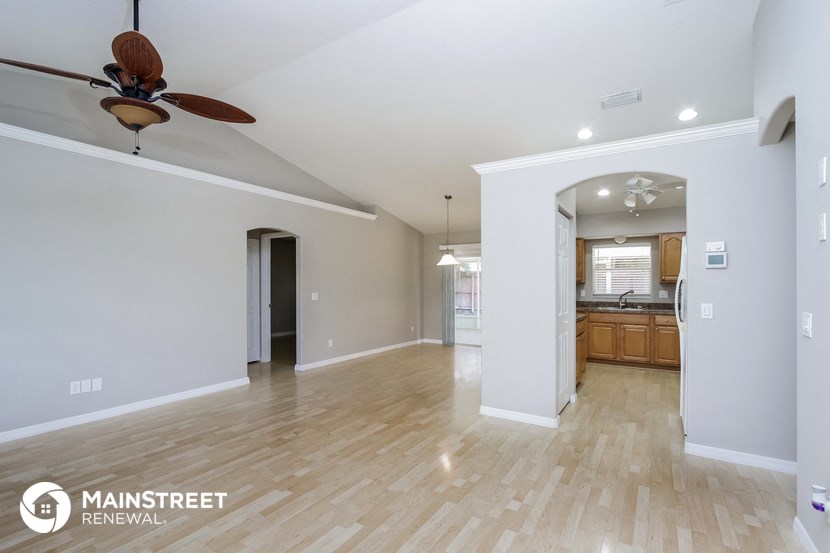 the living room and dining room are open to the kitchen