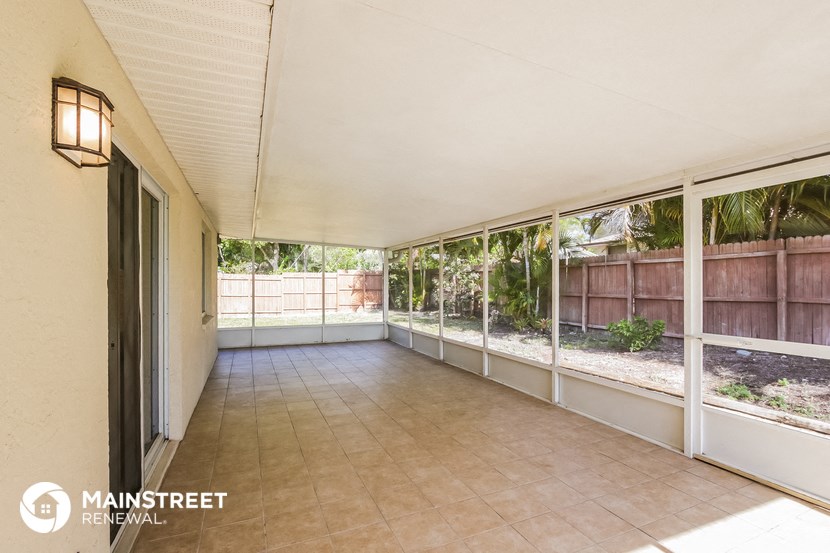 a large room with large windows and a tile floor