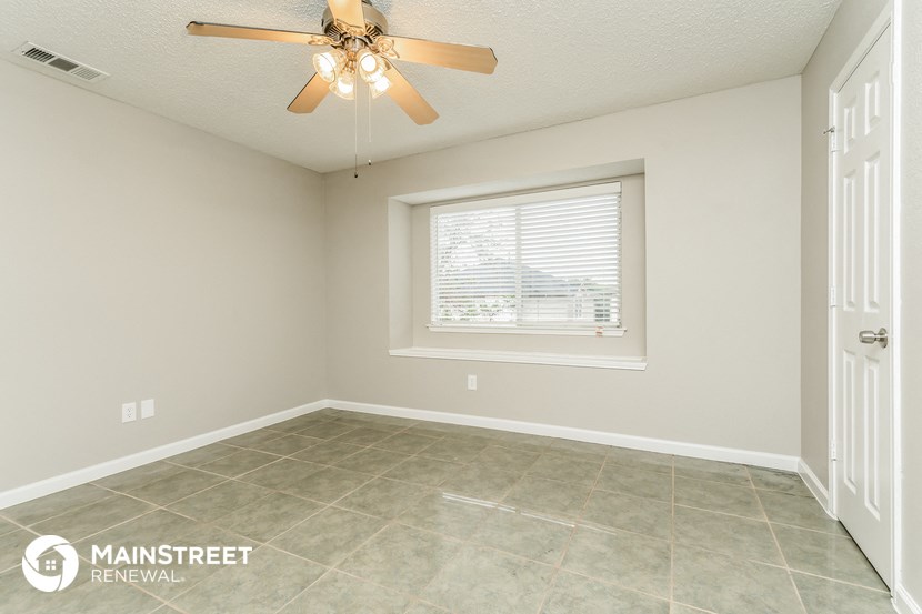 the living room is clean and ready to be used as a dining room