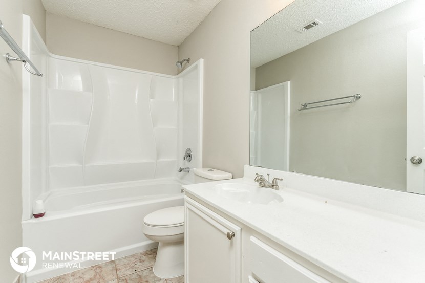 a bathroom with a sink toilet and a bath tub