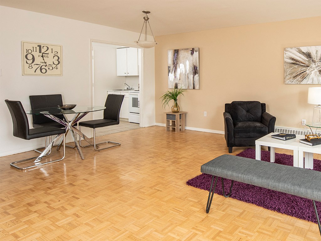 a living room with a table and chairs and a couch