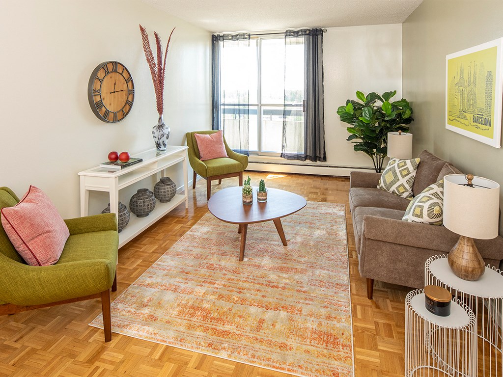 a living room with a couch and a chair and a coffee table
