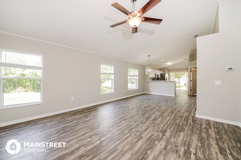 the living room and dining room are open to the kitchen