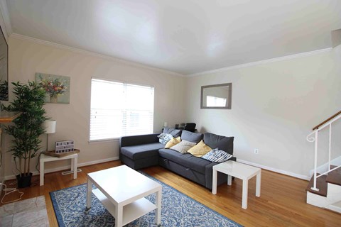 a living room with a couch and a table