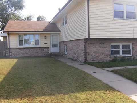 A house with a white door and windows.