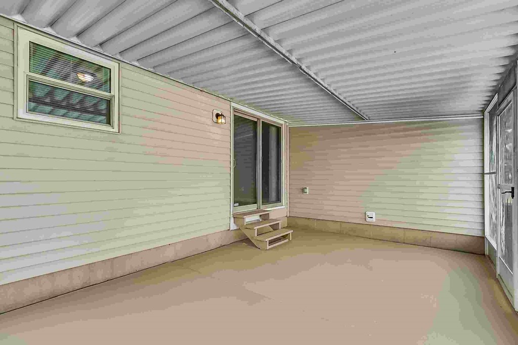 A room with a window and a door is shown.