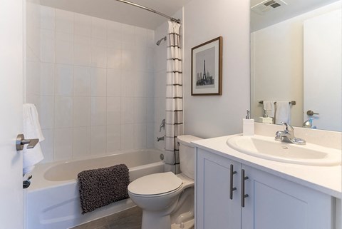 a bathroom with a sink toilet and a bath tub