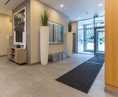 the lobby of a building with a glass door