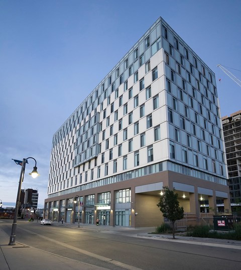 a tall building with a street in front of it