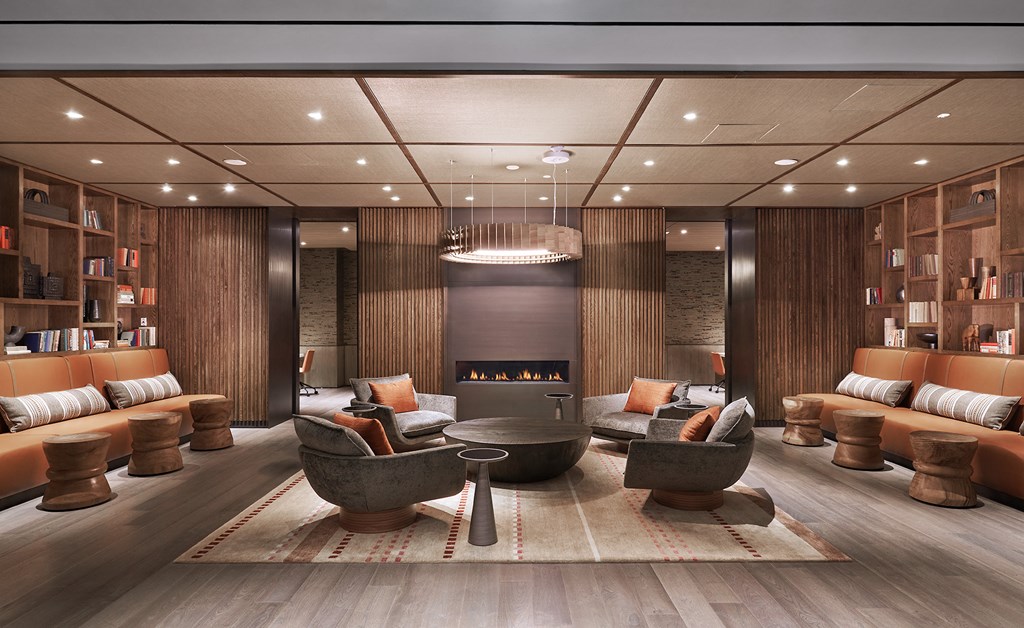 a living room filled with furniture and a fireplace