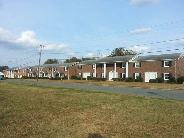 a row of houses on the side of a road