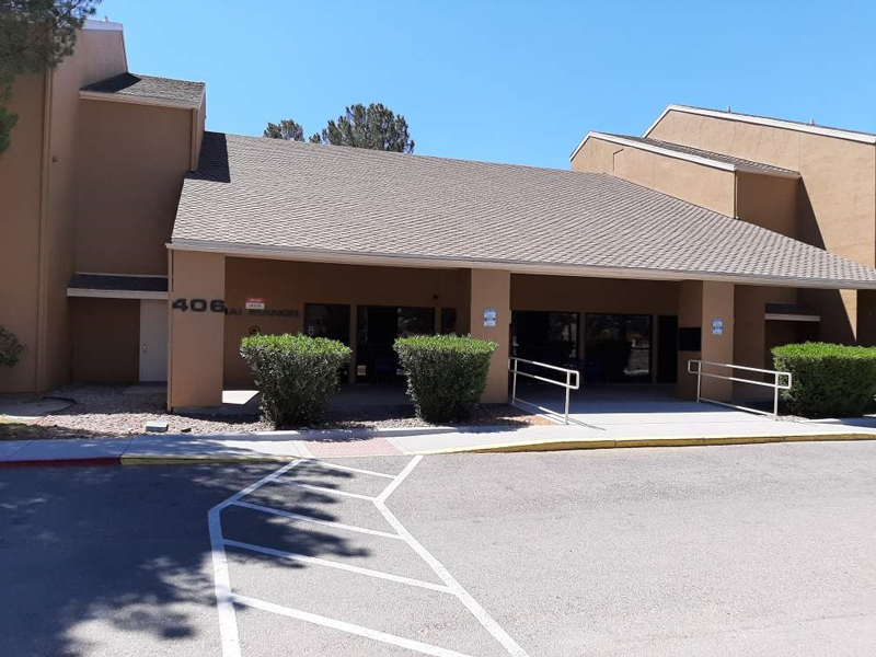 a building with a parking lot in front of it
