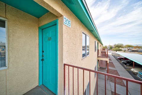 A blue door with the number 205 on it.