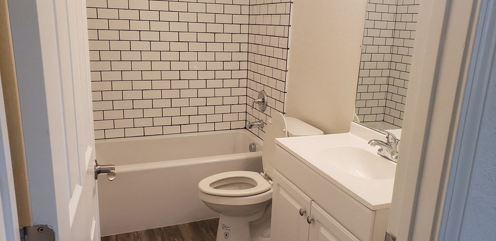 an empty bathroom with a toilet and a sink