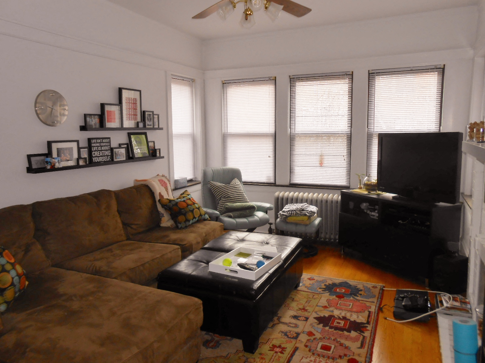 a living room with a couch and a tv