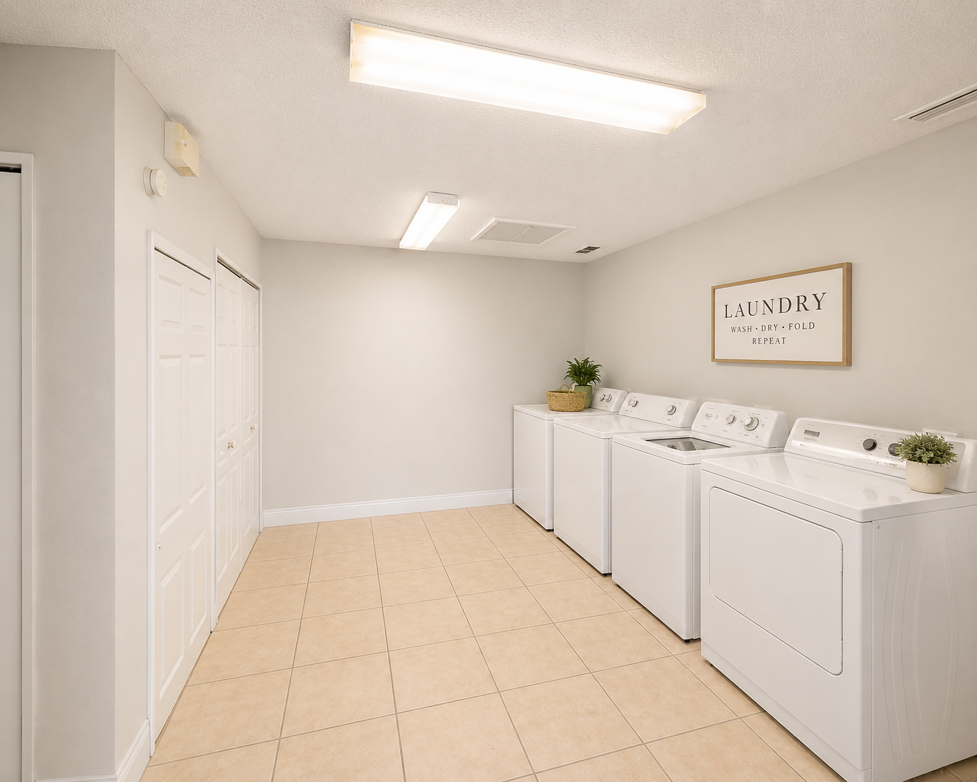 A laundry room with washers and dryers.