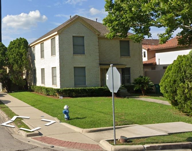 a house with a stop sign in front of it