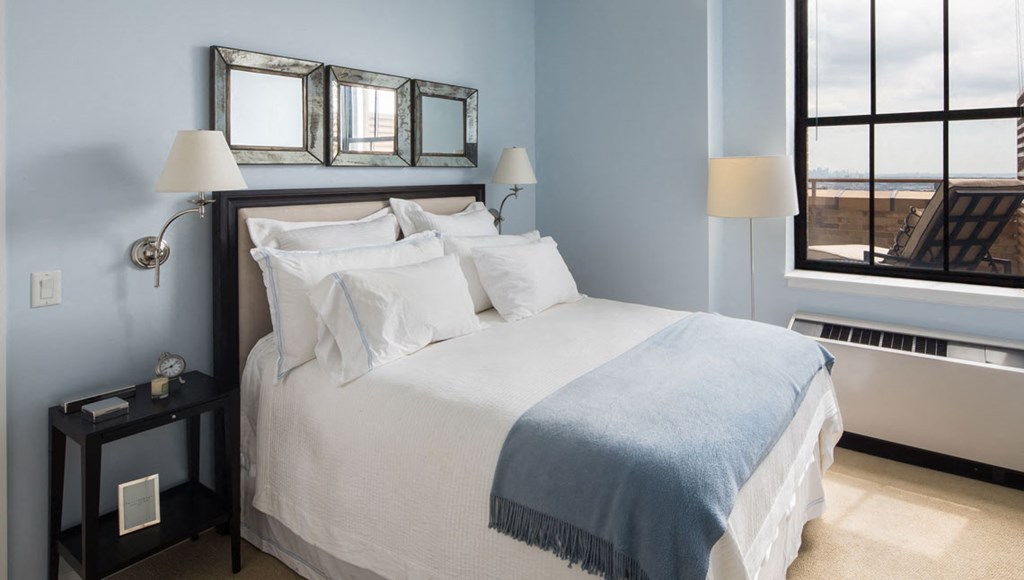 Apartments for Rent in Newark-Eleven80 Apartments Carpeted Bedroom With Modern Decor And Window With City View