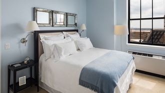 Apartments for Rent in Newark-Eleven80 Apartments Carpeted Bedroom With Modern Decor And Window With City View - Photo Gallery