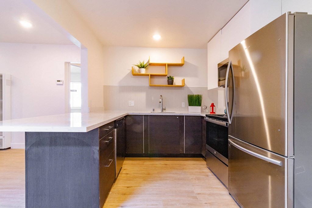 a kitchen with stainless steel appliances and a counter top