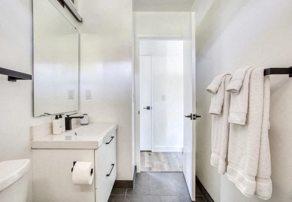 a small bathroom with a sink and a mirror