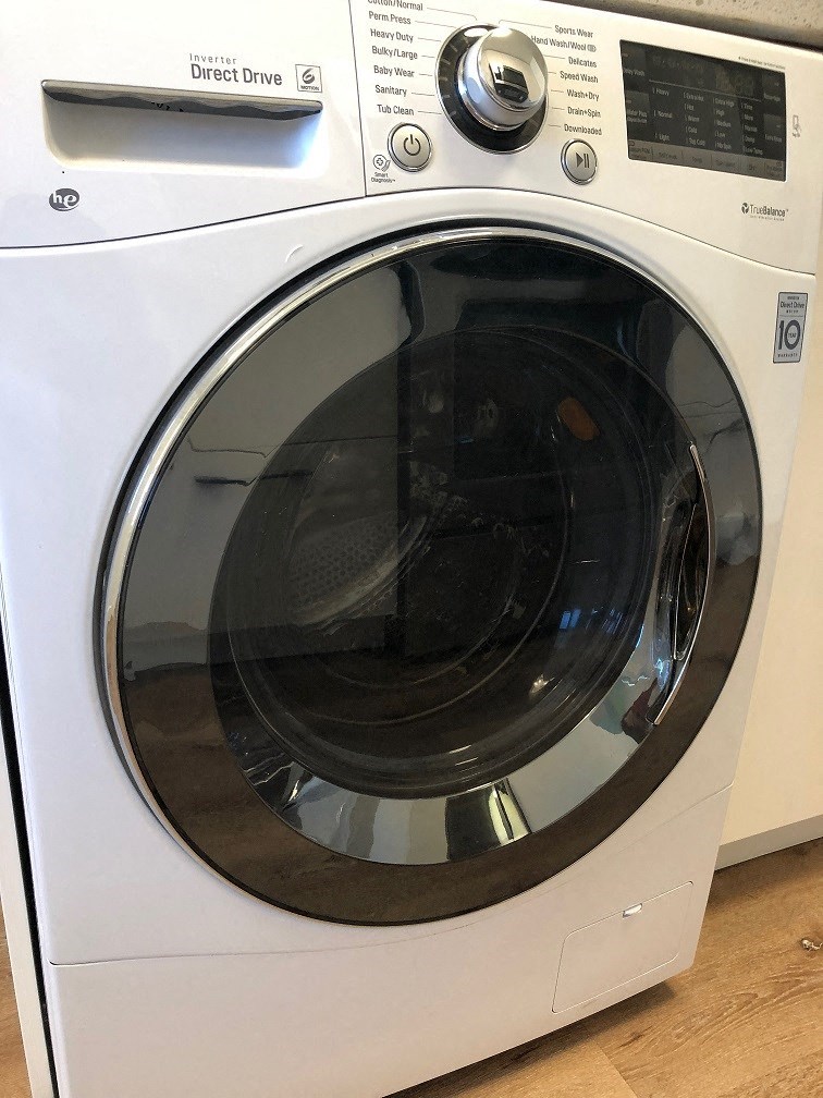 a white washer and dryer in a room