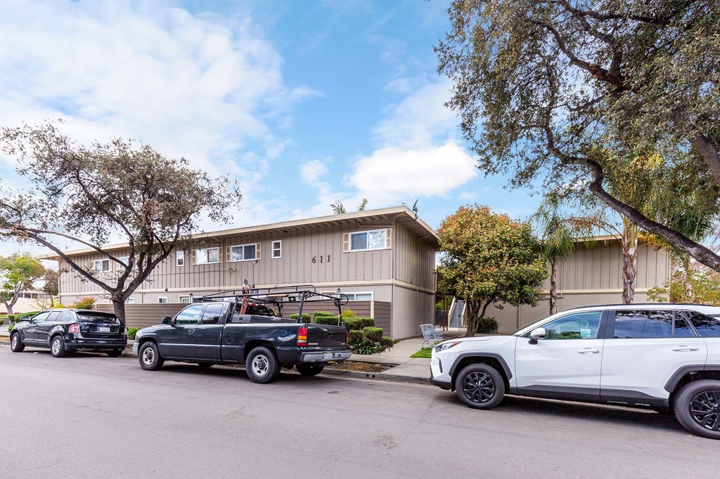 a house with two trucks parked in front of it