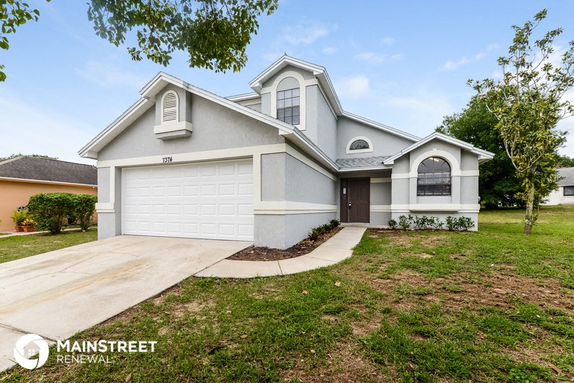 a house with a driveway and a garage door
