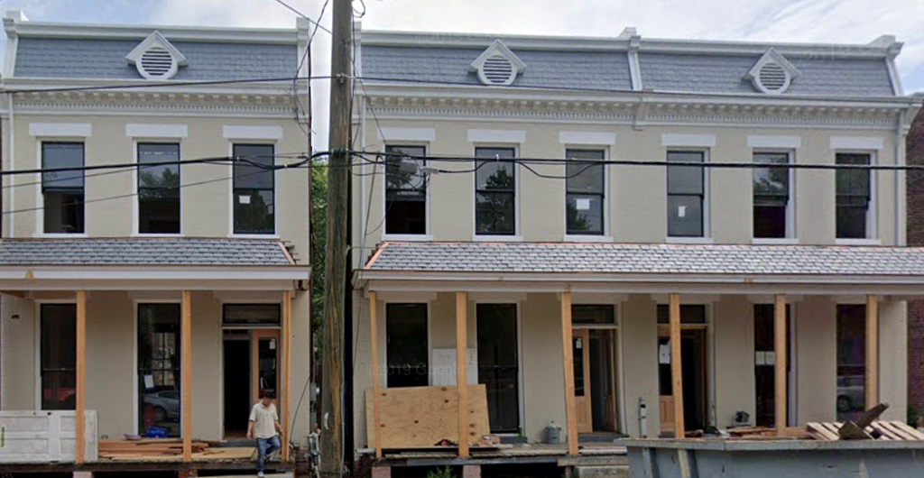 a building is being remodeled in front of another building