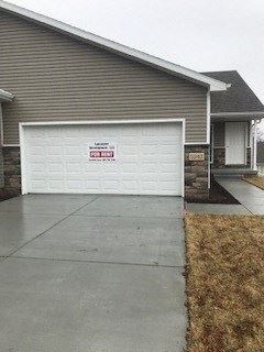 a white garage door on the front of a house