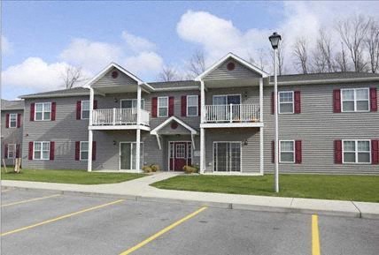 a row of houses on the side of a street