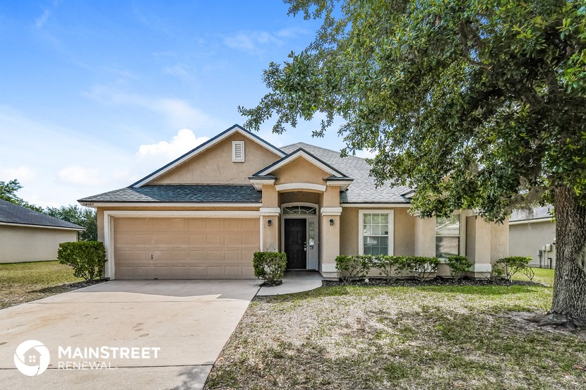 a house with a driveway and a garage door