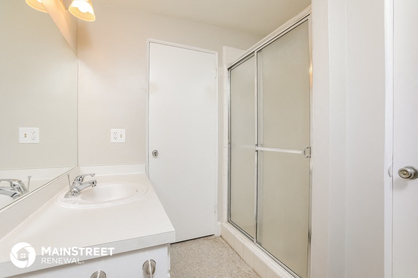 a bathroom with a sink and a shower