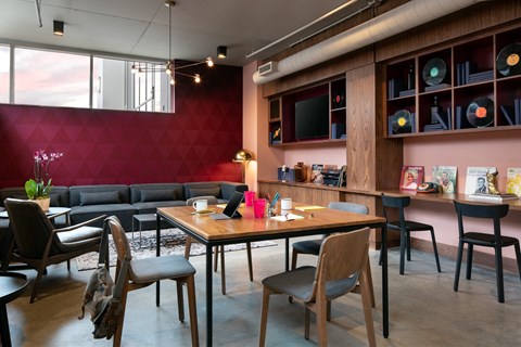 A modern living room with a wooden table and chairs.
