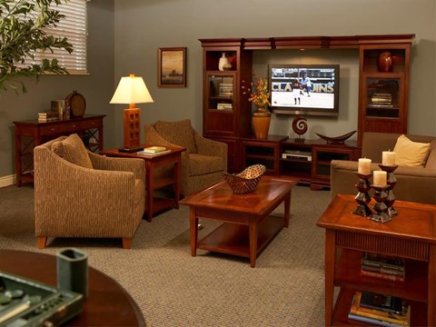 a living room filled with furniture and a television