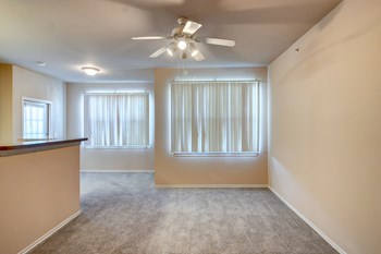 Rosemont at Mayfield Villas Apartments Living Room and Dining Room with Ceiling Fan - Photo Gallery 5