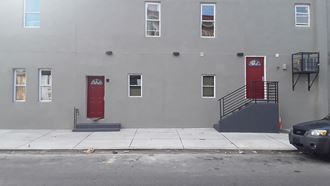 two red doors on the side of a building