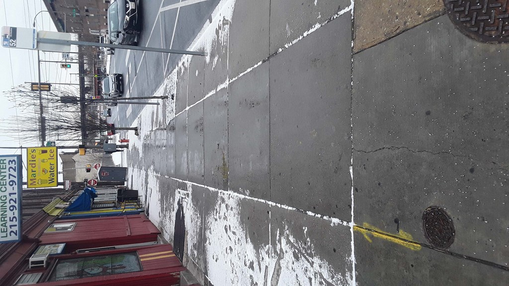 the side of a building with a white line on the wall