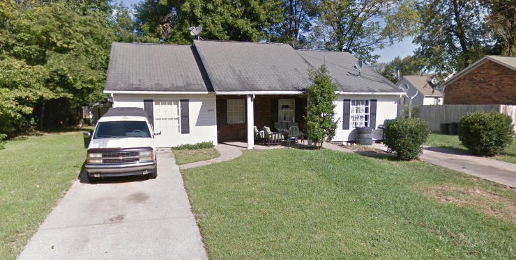 a house with a car parked in front of it