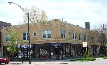 a brick building on the corner of a street