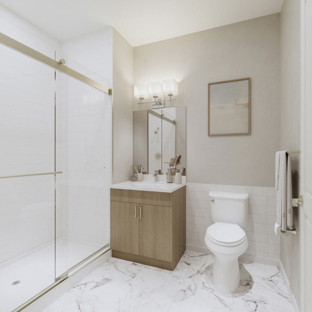 a bathroom with a toilet sink and shower