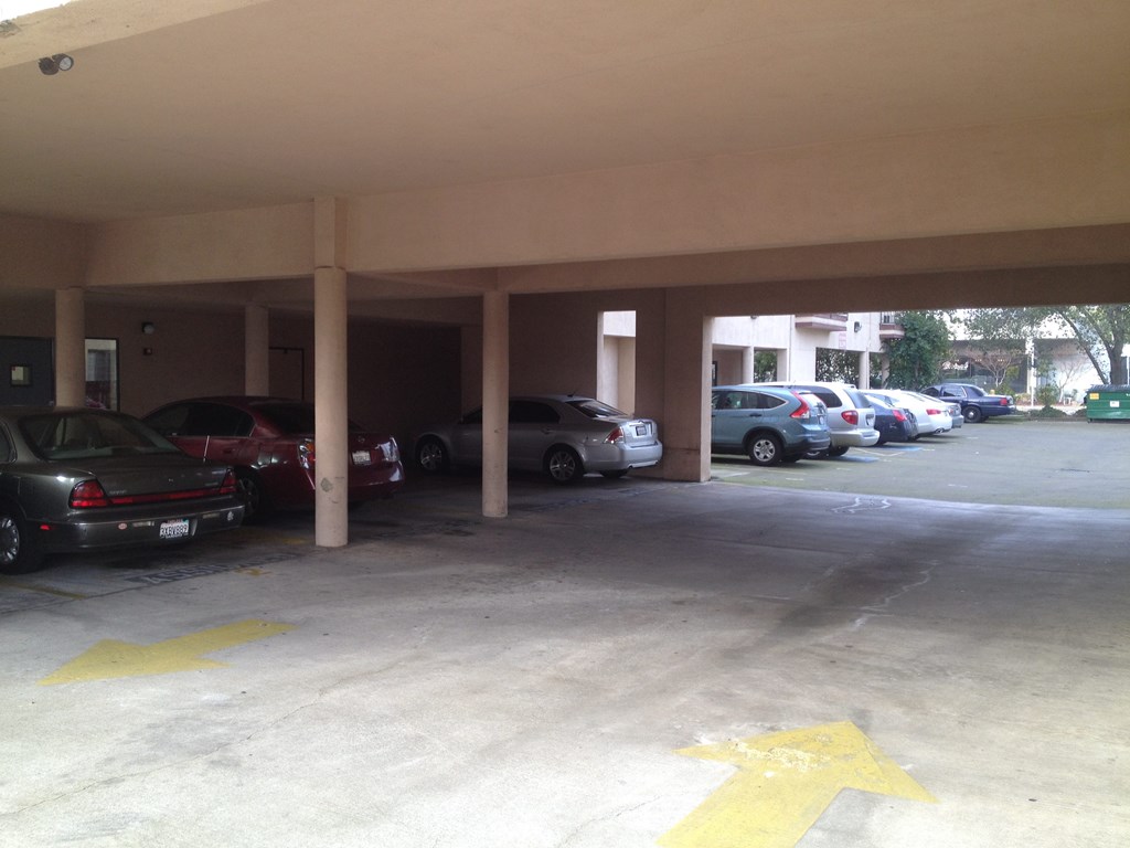 a parking garage with cars parked in it