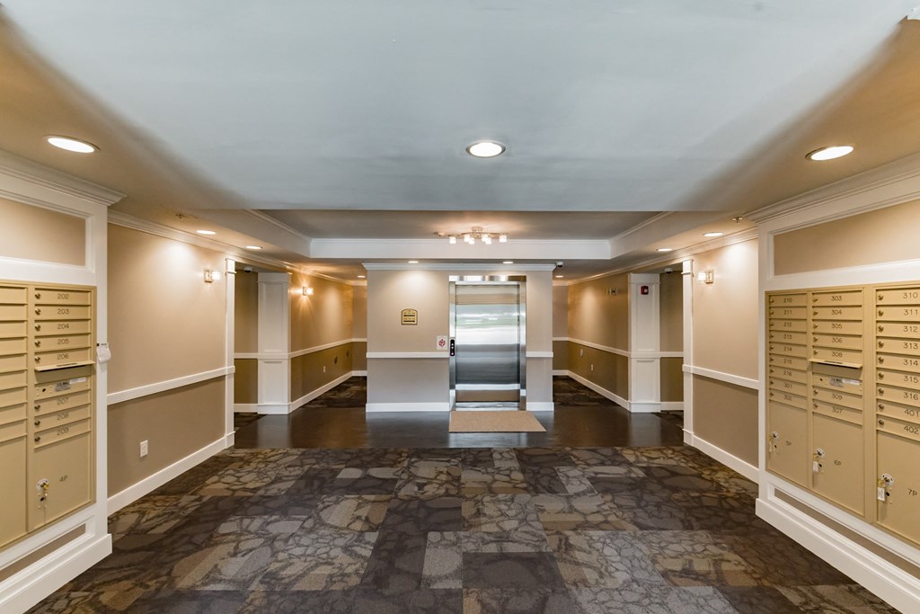 a locker room with lockers and cabinets and lights on the ceiling