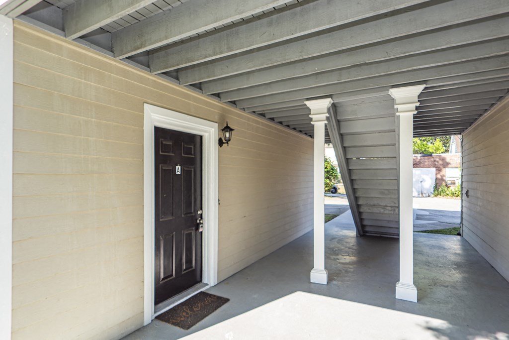 the front door of a house with a porch