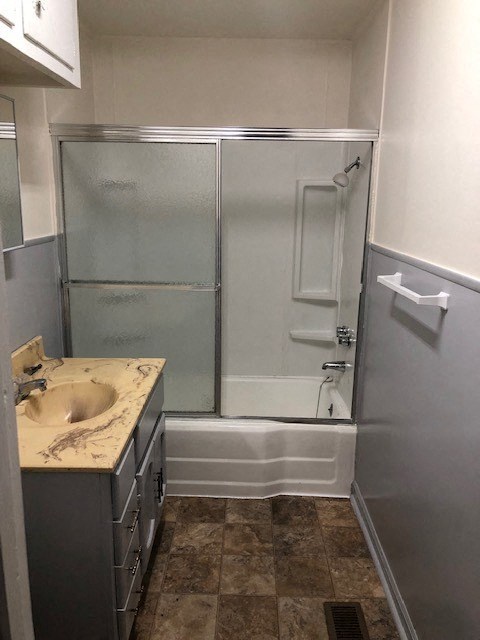 a bathroom with a sink and a shower